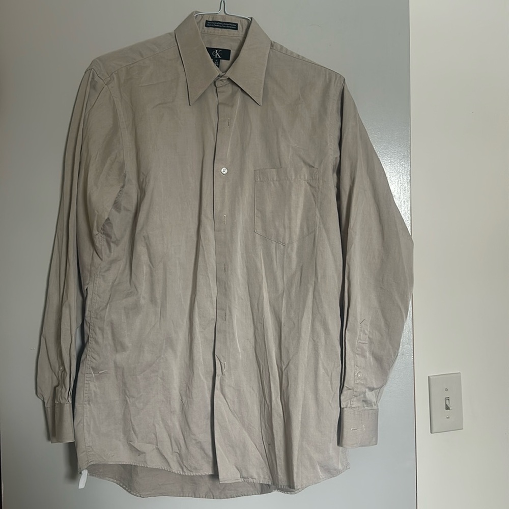 Men’s Calvin Klein, 100% cotton beige button-down shirt.